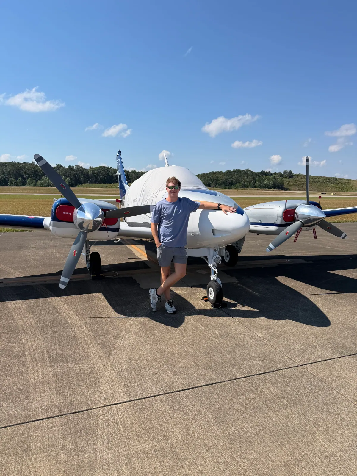 Pilot standing in front of the Beechcraft Baron B55 N3018S
